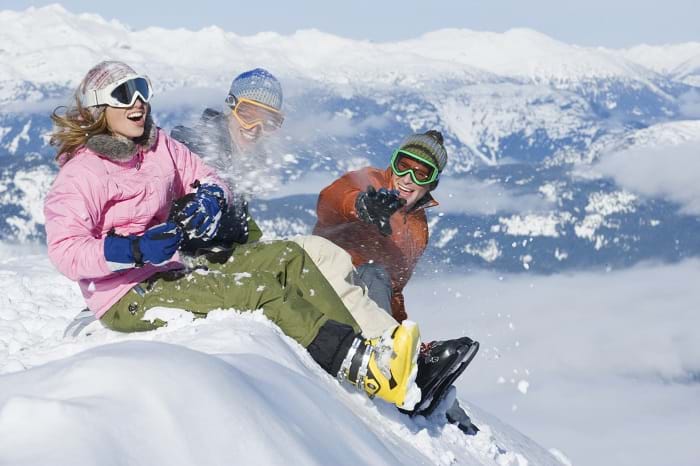 McNally Travel | Whistler Blackcomb Ski Resort | Sitting on a snow bank, Whistler BC