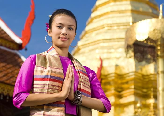 McNally Travel | Traditional Thai woman at a Buddhist Temple | Visit Thailand